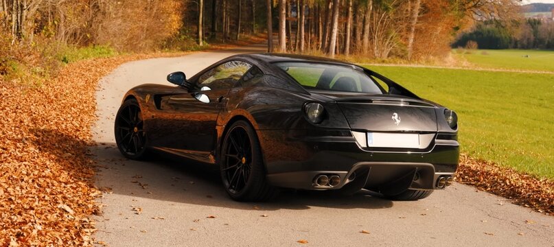 Ferrari 599 GTB, Black, luxury sports car. fast driving on the road