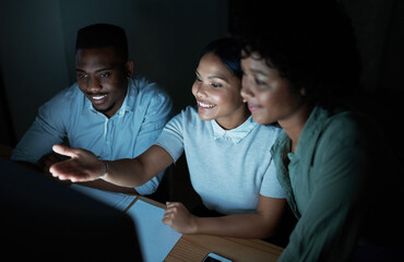Happy, group and meeting with computer at night, proofreading and planning for magazine...