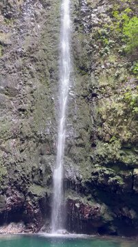 Cinematic tropical waterfall at Caldeir&atilde;o Verde levada trail in the lush forest of Madeira