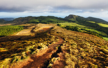 Naklejka premium Aerial view of beautiful lagoon in the Azores islands. Drone landscape view with lines and textures in the background. Top view of volcanic crater, tourist attraction of Portugal.