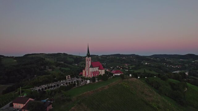 Gorca - Marijina cerkev v Malečniku - magical church near Maribor, Slovenia during sunset, Drone footage