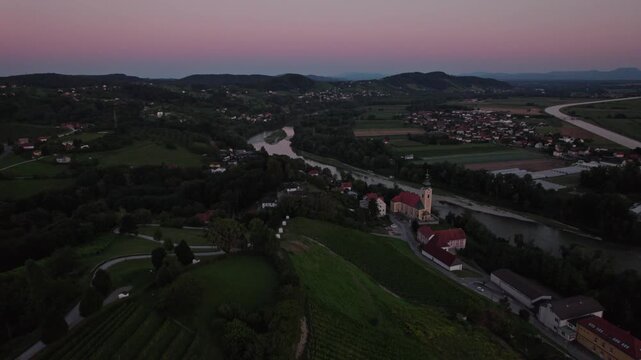 Drone view on the river Drava near Malečnik and Maribor during sunset