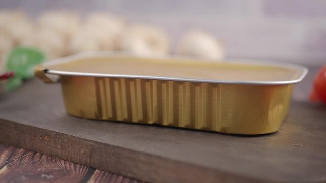 Cooking with canned food and fresh tomatoes in kitchen