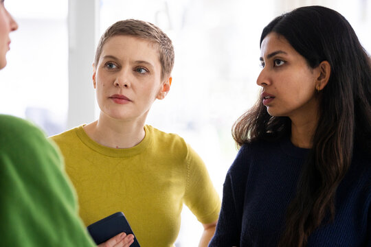 Business team engaged in a focused discussion indoors