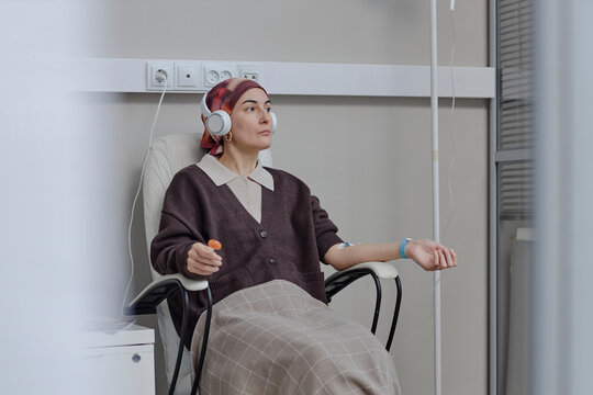 Patient with cancer receiving chemotherapy infusion indoors