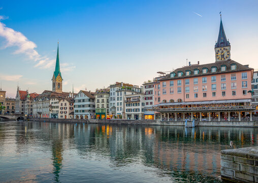 Zurich cityscape with Fraum�nster St. Peter and Limmat river at sunset