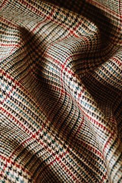 Close up of classic wool tweed fabric with glen check and houndstooth