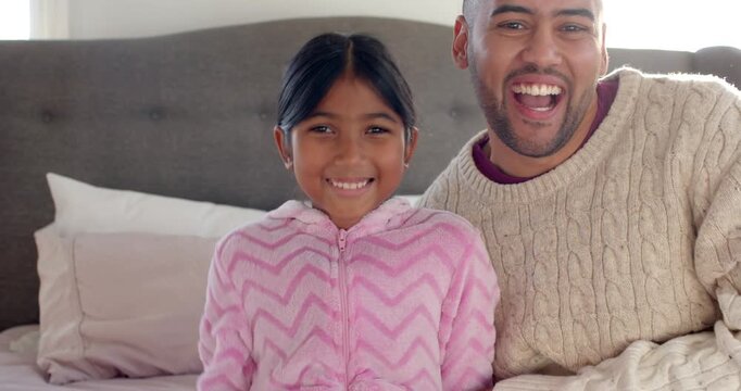 Asian father and daughter giggling after father entering room, tickling girl, leaning on bed