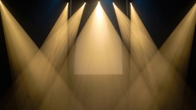 Dramatic stage lighting illuminating a blank rectangular area with converging light beams