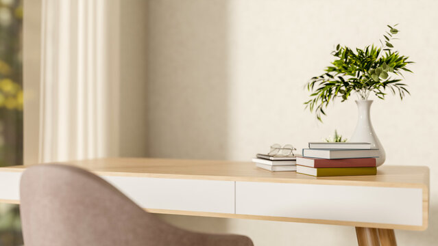 Eyeglasses on books on wooden table aside white wall and natural sunlight from window in modern room