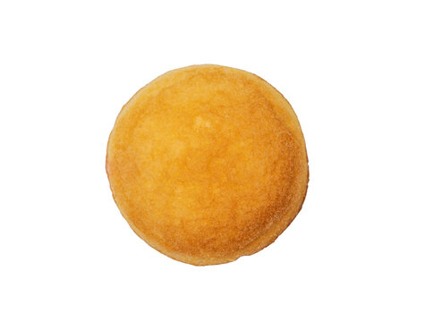 Round golden sponge cake top view isolated. Sweet baked pastry.