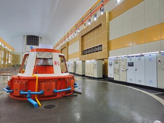 The industrial interior of Ialy Hydroelectric Power Plant featuring massive generators and turbine hall in Gia Lai, Vietnam. © Nature-Andy