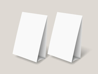 Fototapeta premium Table tent template. White blank paper countertop pop banner stand. Realistic mockup. Desktop promotional graphic display card vector mock-up Stand Up Clear Card Mockup On Table.