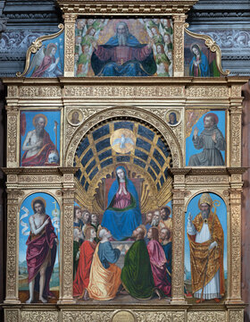 BERGAMO, ITALY - MARCH 18, 2026: The renaissance painting of Pentecost polyptich in the church Chiesa di Santo Spirito by Ambrogio da Fossano - Bergognone (1508).