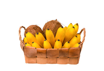 Bunch of ripe organic bananas and coconut in wooden wicker basket on white background. © stockfocus