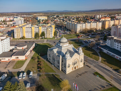 Aerial view of the Jewish Synagogue, its dome glinting under the sun, stands as a beacon amidst the urban landscape, Lucenec, Banska Bystrica Region, Slovakia.