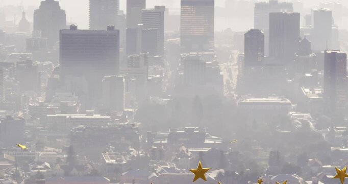 Vertical video: Appearing gold star confetti drifting over hazy downtown skyline, creating sparkle