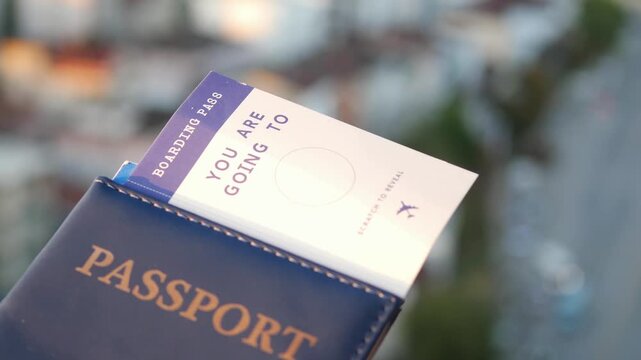 Blue passport with surprise boarding pass revealing scratch off circle travel gift concept in city setting