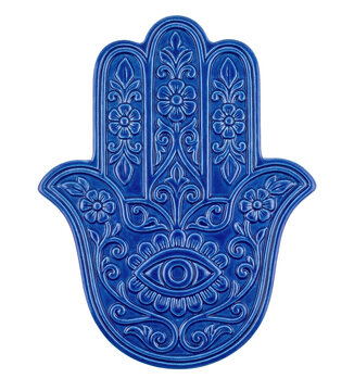 Blue ceramic Hamsa hand with floral engravings isolated on black background