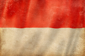 Old vintage flag of Monaco, worn and stained