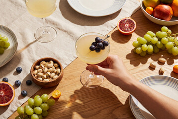 Healthy Lifestyle Summer Table with Fresh Fruits and Refreshing Drink in Natural Light