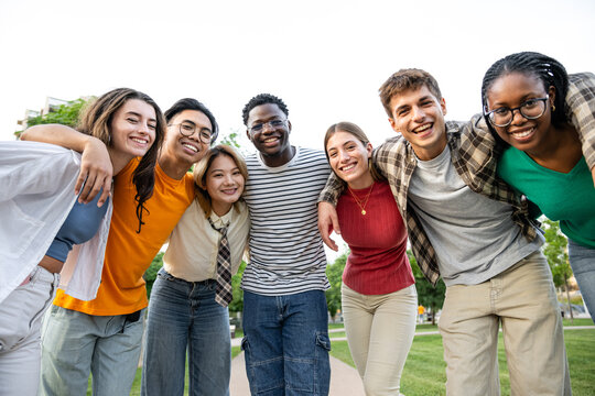A diverse and lively group of friends enjoying a wonderful day spent outdoors together
