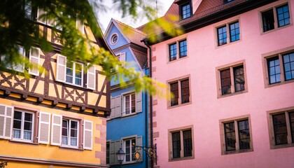 Fototapeta premium Showing three facades in historic district, featuring yellow half-timbered with white shutters
