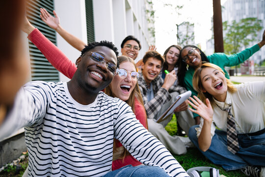 A diverse group of friends having a wonderful time outdoors and enjoying each others company