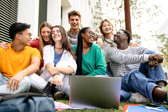 A Diverse Group of Friends Enjoying a Productive Study Session Outdoors in Nature