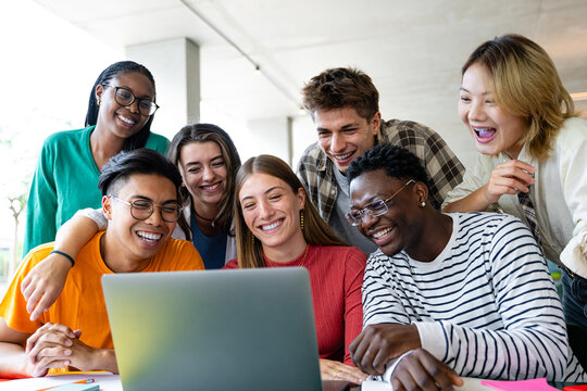 Diverse friends collaborating effortlessly on a laptop in a vibrant, bright space