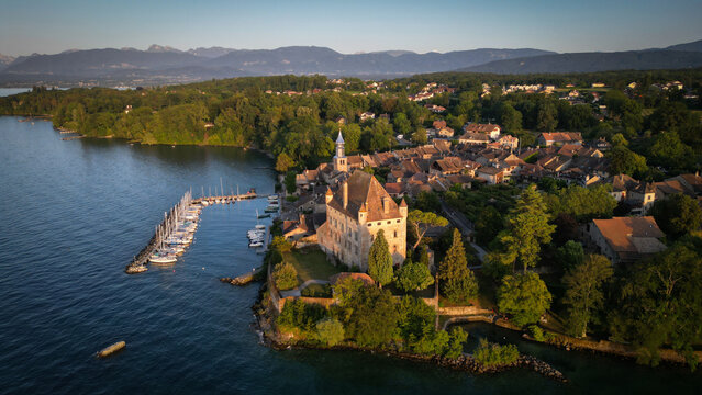 Yvoire, France - 07 July 2023: Aerial view of the medieval castle d'Yvoire with its distinctive architecture, nestled along the tranquil shores of Lake Geneva, where boats bob gently in the marina.