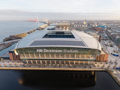LIVERPOOL, MERSEYSIDE, ENGLAND - MARCH 18, 2026: Aerial, Hill Dickinson Stadium at Bramley-Moore Dock, Liverpool, Merseyside with the historic Liverpool docklands in the background