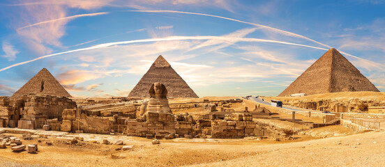 Great Sphinx and the Pyramids of Giza, beautiful sunset panorama of Cairo region, Egypt
