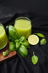 Green smoothie with basil lime and broccoli on dark background healthy drink © reddish