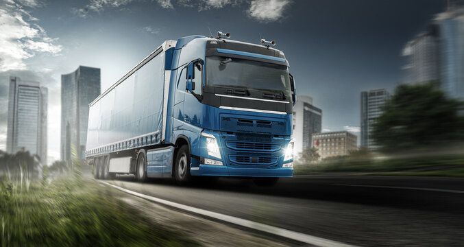 LKW auf einer Stra&szlig;e im Hintergrund eine Stadt