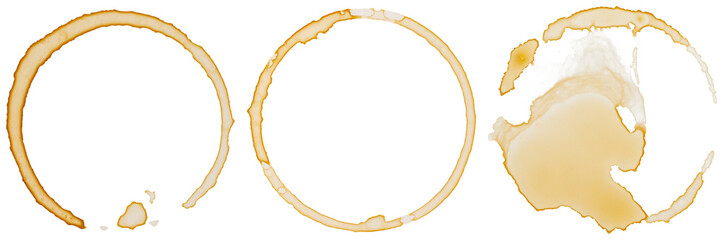 Three distinct coffee cup rings and splatters, a realistic photograph isolated on a transparent background for design.