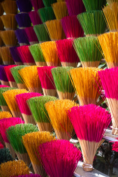 View of vibrant bundles of dyed incense sticks create a mesmerizing display of color and texture, a sensory feast, Hue, Vietnam.