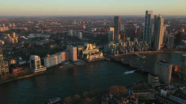 London skyline showing River Thames with Vauxhall Bridge and the MI6 Building at sunset, urban architecture, residential areas, and modern skyscrapers