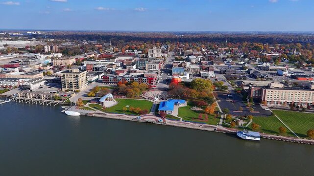 Bay City Michigan downtown district riverfront with commercial buildings in aerial view