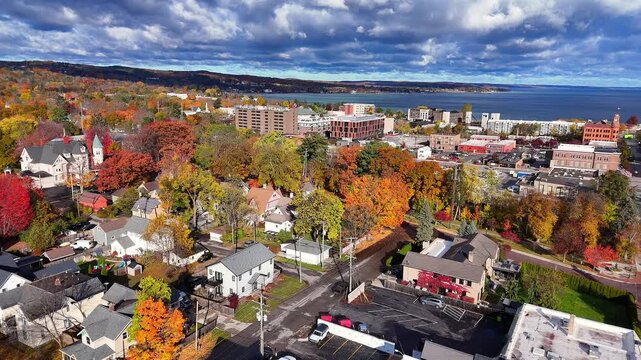 Traverse City, Michigan, USA during autumn, colorful foliage, buildings, and Grand Traverse Bay