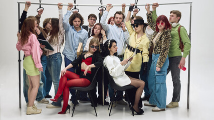 Crowded group of people holding handrails standing tightly in subway carriage. Concept of rush hour...
