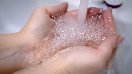 Fototapeta premium Hands Washing Under Running Water for Hygiene and Cleanliness, have fun and enjoy