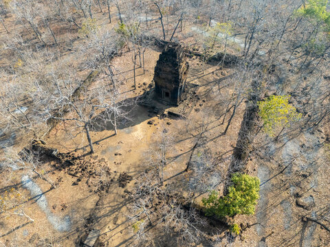 Aerial view of ancient Prasat Neang Kmao temple standing starkly against the dry, brown landscape, a testament to time and history, Prasat Neang kmao, Cambodia.