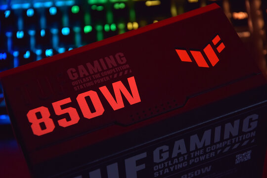 Computer AC power supply Asus Tuf 850w on a dark background.