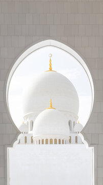 View of gleaming white domes and intricate archways create a serene and majestic scene, bathed in soft light, showcasing architectural brilliance, Abu Dhabi, United Arab Emirates.
