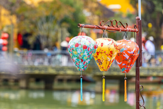 Hoi An, Vietnam - 28 January 2026: View of vibrant lanterns casting soft glows over the tranquil waters of Hoi An Lantern Bridge, creating a magical atmosphere.