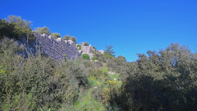 Ancient city walls of Xanthos in Turkey under a clear blue sky