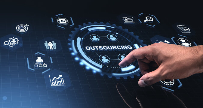 Digital outsourcing interface with hand interacting with illuminated business icons on futuristic tech screen for management operations.