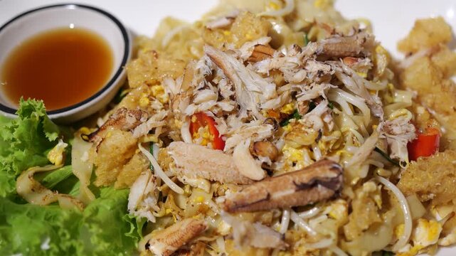  Close Up Shot of Stir Fried Fish Maw with Crab Meat The menu is both street food and restaurant food in Thailand. It is very popular for both Thai people and tourists
