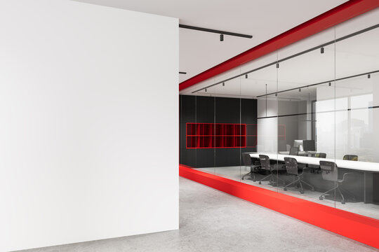 Modern office interior with large empty wall for poster mockup and glass meeting room featuring red accents in contemporary architecture design. 3D Rendering